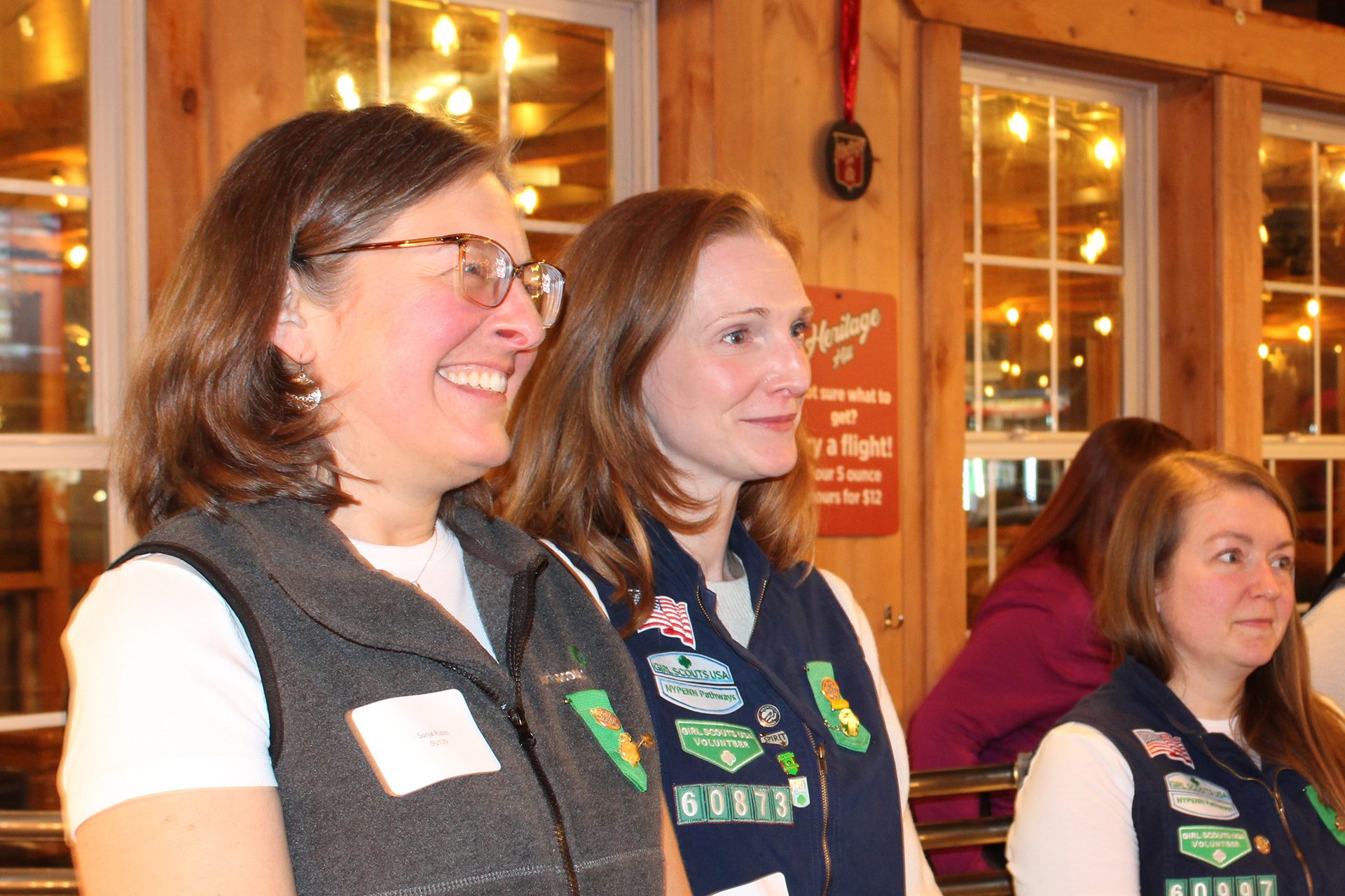 photo of two volunteers smiling at a volunteer award dinner